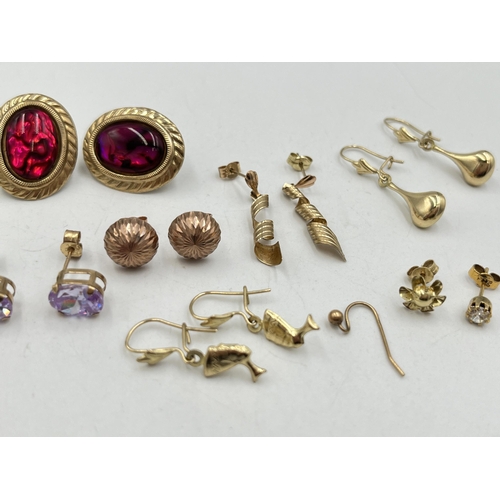 2022 - A collection of 9ct and yellow metal earrings to include 9ct gold pink gemstone earrings, yellow met... 