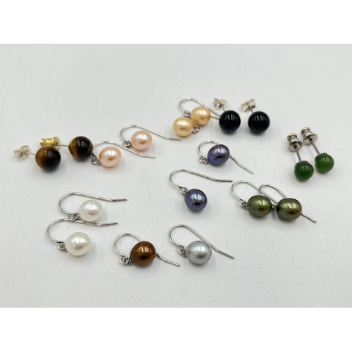 2023 - A collection of .925 silver and white metal gemstone earrings to include tiger's eye, simulated pear... 