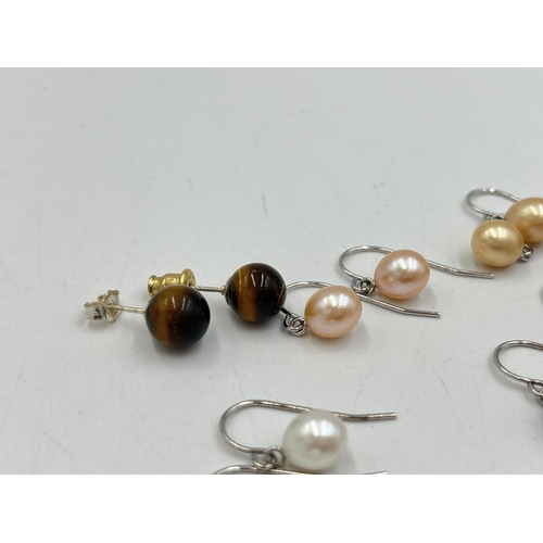 2023 - A collection of .925 silver and white metal gemstone earrings to include tiger's eye, simulated pear... 