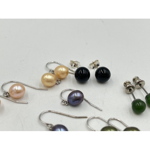 2023 - A collection of .925 silver and white metal gemstone earrings to include tiger's eye, simulated pear... 