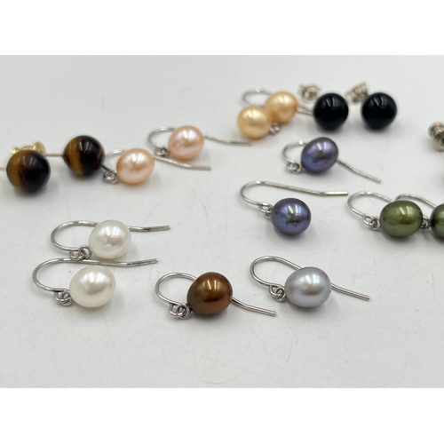 2023 - A collection of .925 silver and white metal gemstone earrings to include tiger's eye, simulated pear... 