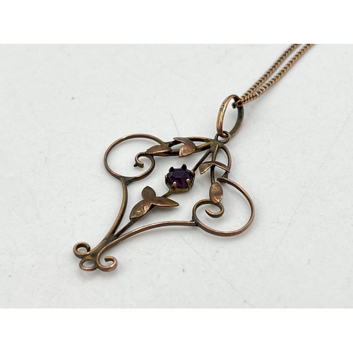 2050 - An Art Nouveau 9ct gold amethyst floral lavalier pendant necklace - approx. gross weight 3g