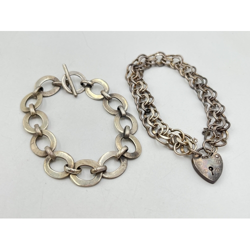 2053 - Two hallmarked sterling silver bracelets, one hallmarked London with heart shaped padlock clasp, dat... 