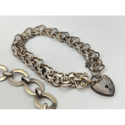 2053 - Two hallmarked sterling silver bracelets, one hallmarked London with heart shaped padlock clasp, dat... 