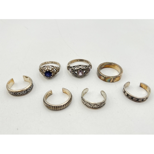 2055 - Seven .925 silver and white metal rings - approx. gross weight 23g