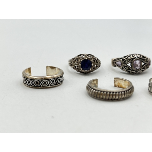 2055 - Seven .925 silver and white metal rings - approx. gross weight 23g