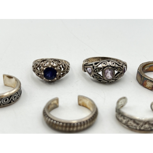 2055 - Seven .925 silver and white metal rings - approx. gross weight 23g