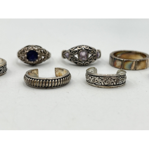 2055 - Seven .925 silver and white metal rings - approx. gross weight 23g