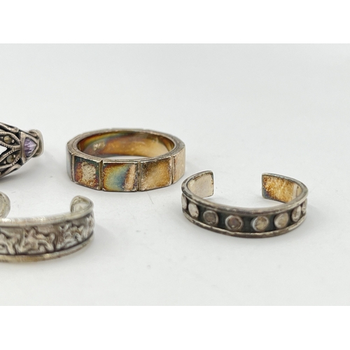 2055 - Seven .925 silver and white metal rings - approx. gross weight 23g