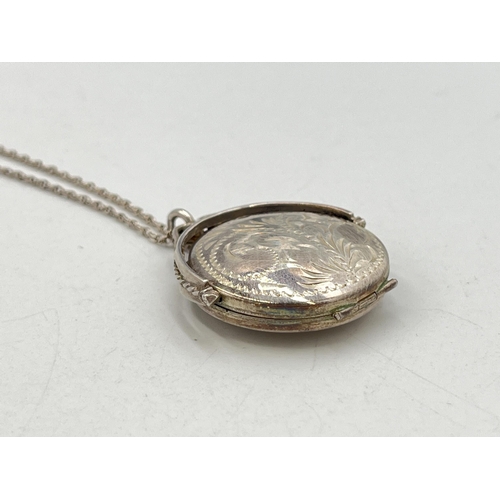 2056 - Two pieces of .925 silver jewellery, one circular locket pendant necklace and one CZ tennis bracelet... 