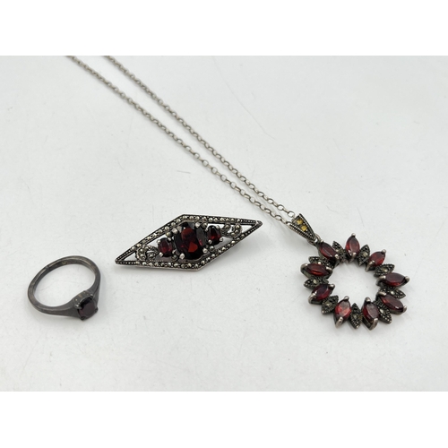 2059 - Three pieces of .925 silver and garnet jewellery, one hallmarked Birmingham solitaire ring, size N½,... 