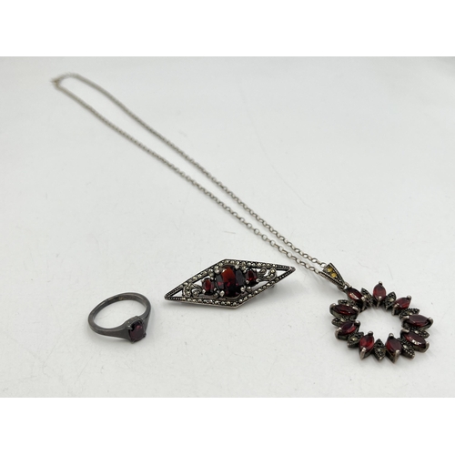 2059 - Three pieces of .925 silver and garnet jewellery, one hallmarked Birmingham solitaire ring, size N½,... 