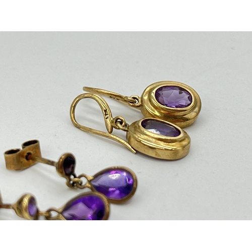 2060 - Two pairs of 9ct gold amethyst drop earrings - approx. gross weight 2.6g