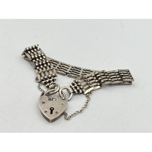 2081 - A J. A. Main hallmarked Birmingham sterling silver bracelet with heart shaped padlock clasp, dated 1... 