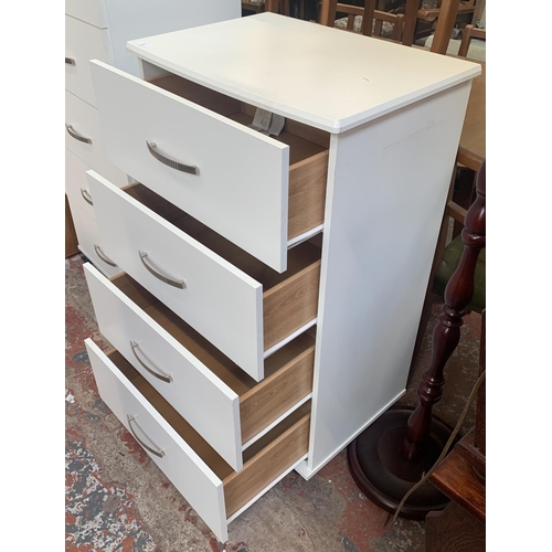 127 - A modern white laminate chest of drawers - approx. 99cm high x 60cm wide x 43cm deep