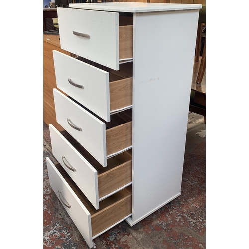 128 - A modern white laminate chest of drawers - approx. 122cm high x 60cm wide x 43cm deep