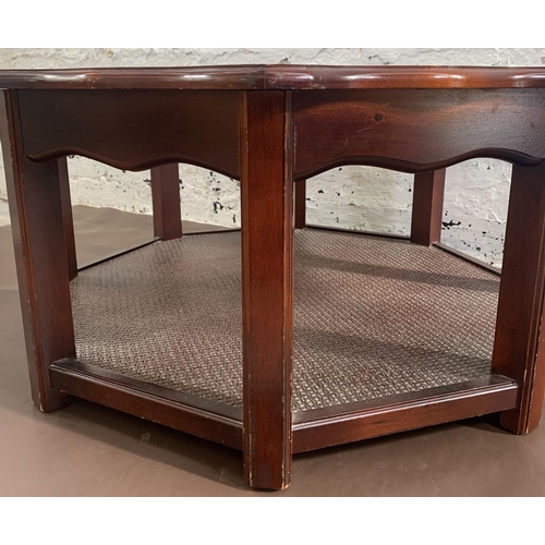 131 - A late 20th century mahogany and smoked glass octagonal serpentine coffee table - approx. 39cm high ... 