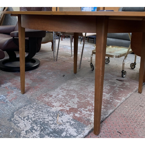 132 - A mid 20th century teak extending dining table - approx. 74cm high x 117cm wide x 155cm long