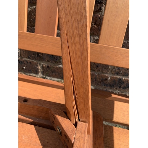 142 - A Rowlinson Garden Products Ltd teak garden bench with side table - approx. 91cm high x 120cm wide x... 