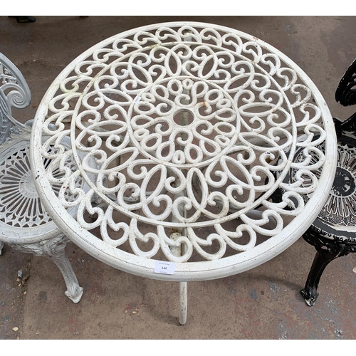 144 - A Victorian style cast metal three piece patio set comprising circular table and two chairs - table ... 