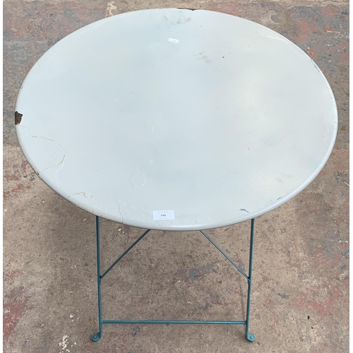 146 - A metal circular top folding bistro table - approx. 72cm high x 70cm diameter