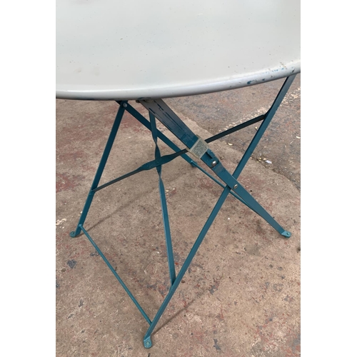 146 - A metal circular top folding bistro table - approx. 72cm high x 70cm diameter