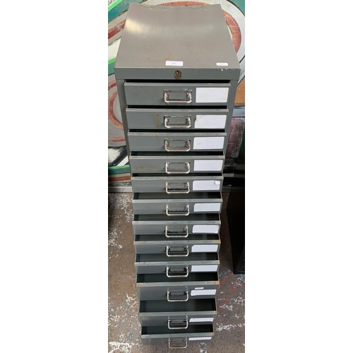 167 - A mid 20th century grey metal twelve drawer office filing cabinet - approx. 100cm high x 28cm wide x... 