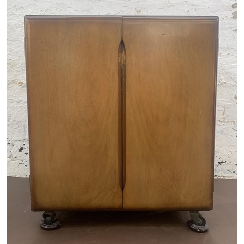 55 - A mid 20th century walnut two door record cabinet - approx. 62cm high x 53cm wide x 46cm deep