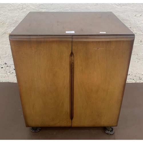 55 - A mid 20th century walnut two door record cabinet - approx. 62cm high x 53cm wide x 46cm deep