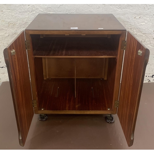 55 - A mid 20th century walnut two door record cabinet - approx. 62cm high x 53cm wide x 46cm deep