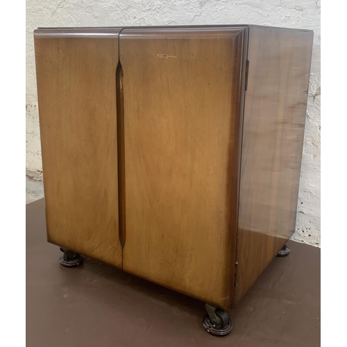 55 - A mid 20th century walnut two door record cabinet - approx. 62cm high x 53cm wide x 46cm deep