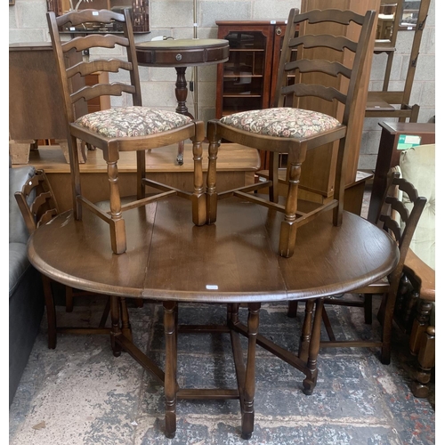 56 - A Priory oak drop leaf gate leg dining table and four ladder back chairs - approx. 76cm high x 112cm... 