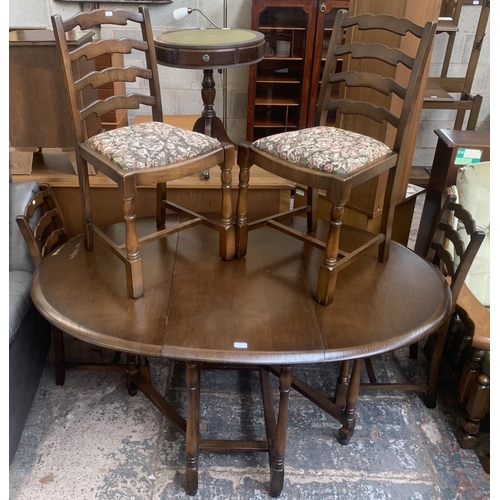 56 - A Priory oak drop leaf gate leg dining table and four ladder back chairs - approx. 76cm high x 112cm... 