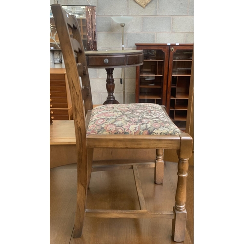 56 - A Priory oak drop leaf gate leg dining table and four ladder back chairs - approx. 76cm high x 112cm... 