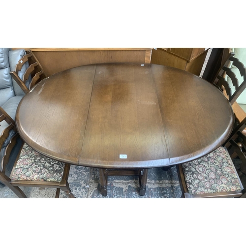 56 - A Priory oak drop leaf gate leg dining table and four ladder back chairs - approx. 76cm high x 112cm... 