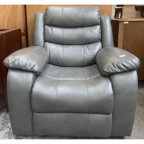 57 - A modern grey leather reclining armchair - approx. 96cm high x 93cm wide x 80cm deep