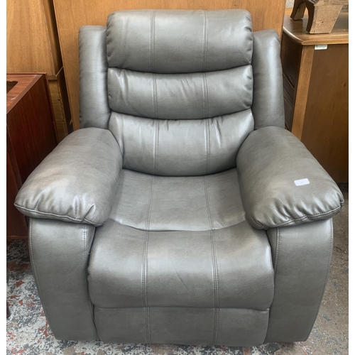 57 - A modern grey leather reclining armchair - approx. 96cm high x 93cm wide x 80cm deep