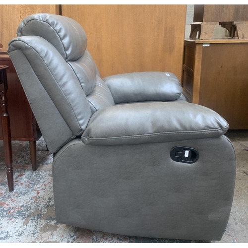 57 - A modern grey leather reclining armchair - approx. 96cm high x 93cm wide x 80cm deep