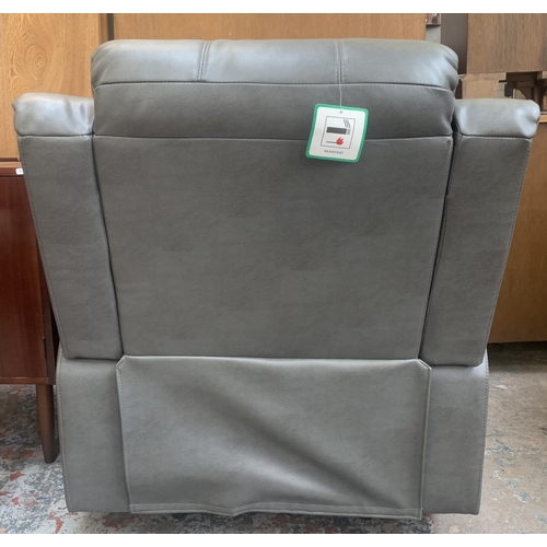 57 - A modern grey leather reclining armchair - approx. 96cm high x 93cm wide x 80cm deep