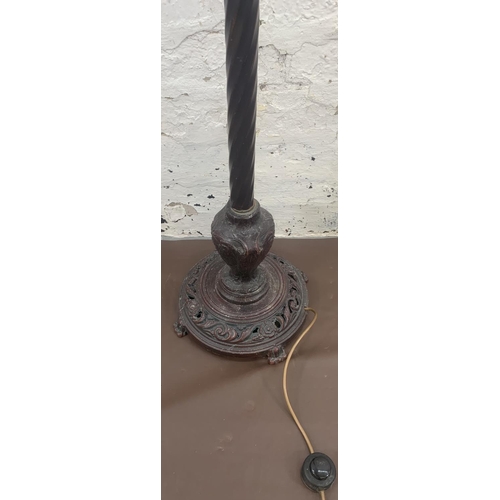 60 - A 19th century style bronzed cast metal twisted standard lamp on circular footed base - approx. 170c... 