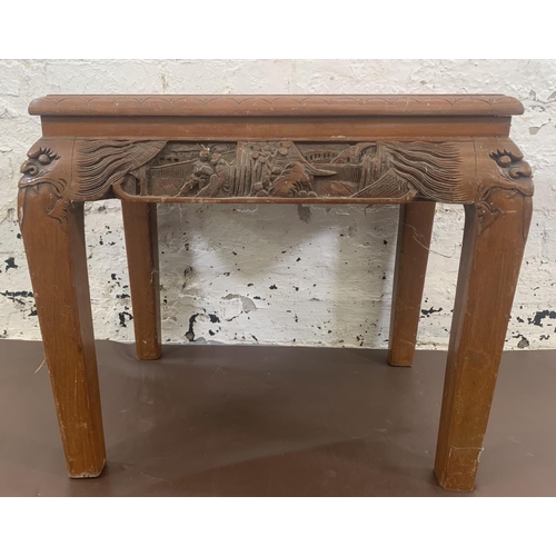 62 - A Chinese carved hardwood side table - approx. 47cm high x 40cm wide x 53cm long