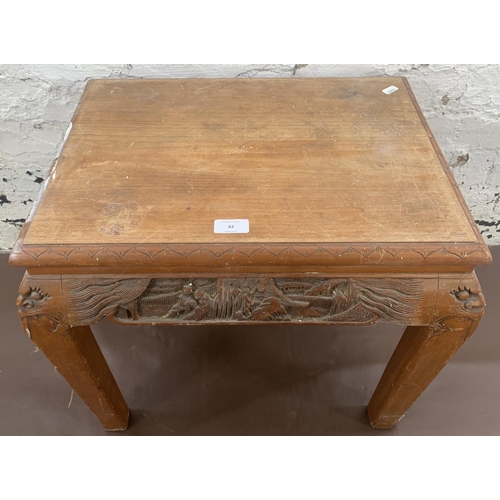 62 - A Chinese carved hardwood side table - approx. 47cm high x 40cm wide x 53cm long