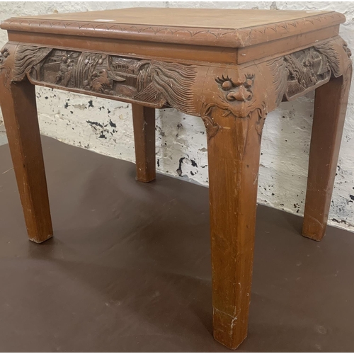 62 - A Chinese carved hardwood side table - approx. 47cm high x 40cm wide x 53cm long