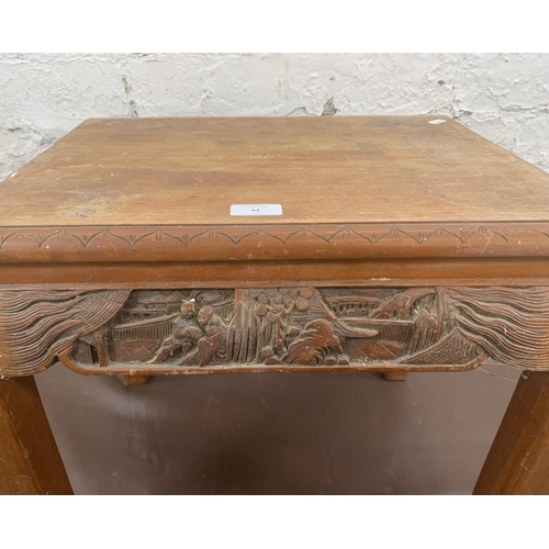 62 - A Chinese carved hardwood side table - approx. 47cm high x 40cm wide x 53cm long