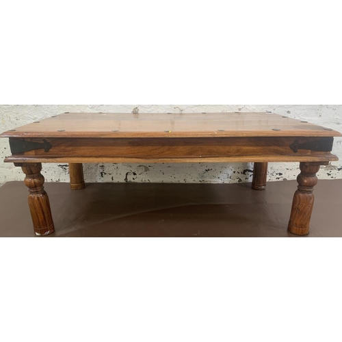 64 - An Indian sheesham wood rectangular coffee table - approx. 40cm high x 60cm wide x 110cm long