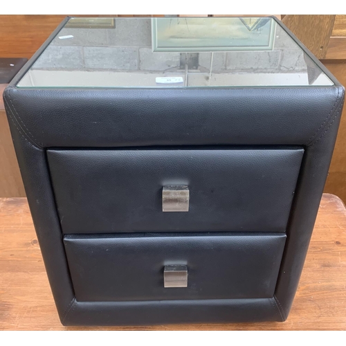 65 - Three pieces of modern furniture, one black faux leather and glass top bedside chest of drawers, one... 