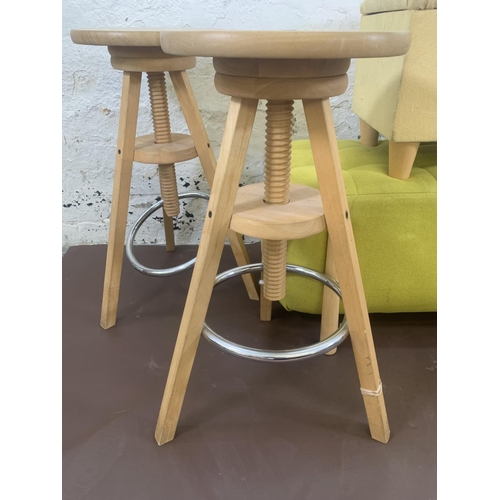 66 - Four pieces of modern furniture, two beech height adjustable bar stools, one yellow fabric upholster... 