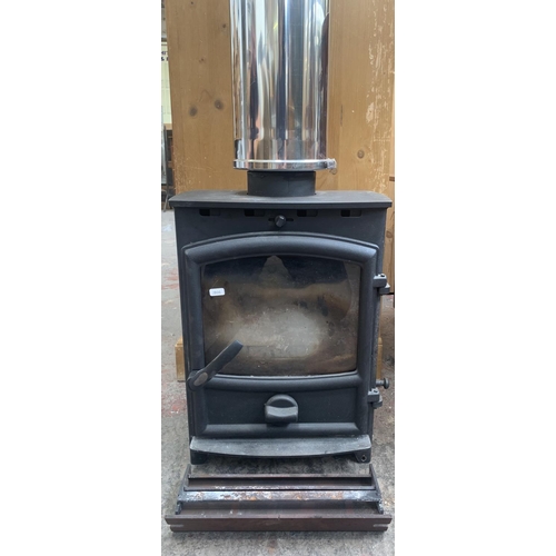 76 - A Fireline cast iron freestanding stove with Duoten 1000mm conduit - approx. 197cm high