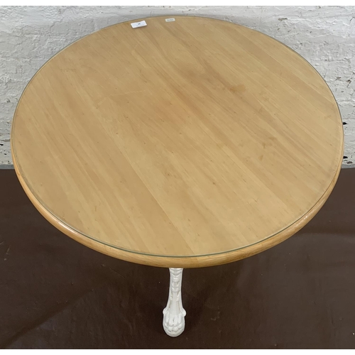 84 - A Victorian white painted cast iron Britannia pub table with later added beech circular top - approx... 