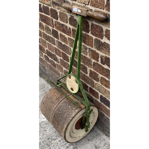 93 - An antique Ironcrete cast iron and wooden handled garden roller - approx. 102cm high